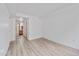 Clean hallway with light walls and hardwood floors at 2850 E College Ave # 2, Boulder, CO 80303