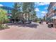 Outdoor town square with brick pavement, shops, and people at 2850 E College Ave # 2, Boulder, CO 80303