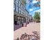 Brick-paved pedestrian area with shops and people walking at 2850 E College Ave # 2, Boulder, CO 80303