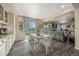 Open concept dining area with views of the outdoor space and access to the living room at 3871 Starry Night Loop, Castle Rock, CO 80109