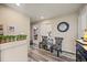 Inviting hallway features stylish accents chairs, wood flooring and a modern clock at 3871 Starry Night Loop, Castle Rock, CO 80109