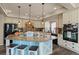 Large kitchen island with seating offers ample space for meal prep and casual dining at 3871 Starry Night Loop, Castle Rock, CO 80109