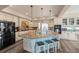 Stylish kitchen island with seating and plenty of counter space, perfect for entertaining at 3871 Starry Night Loop, Castle Rock, CO 80109