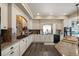 Lovely kitchen with granite counters, tiled backsplash, white cabinets, and stainless steel appliances at 3871 Starry Night Loop, Castle Rock, CO 80109