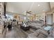 Expansive living room with a hardwood flooring, lots of seating, and bright, natural light at 3871 Starry Night Loop, Castle Rock, CO 80109