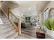 Bright living room with a fireplace, hardwood floors, a ceiling fan and lots of natural light at 3871 Starry Night Loop, Castle Rock, CO 80109