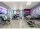Spacious living room with modern decor, ample seating, and a large television for entertainment at 3871 Starry Night Loop, Castle Rock, CO 80109