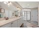 Bright main bathroom with double sinks, ample counter space, and spacious shower at 3871 Starry Night Loop, Castle Rock, CO 80109