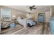 Bright main bedroom with ceiling fan, seating area, and scenic outdoor views at 3871 Starry Night Loop, Castle Rock, CO 80109