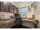 Stylish home office features custom desk with shelves and modern décor at 3871 Starry Night Loop, Castle Rock, CO 80109