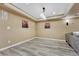 Finished basement area with gray wood-look flooring, neutral walls, and recessed lighting at 10375 Knollside Dr, Parker, CO 80134