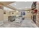 Finished basement with a stone fireplace, comfortable seating, and an inviting atmosphere at 10375 Knollside Dr, Parker, CO 80134