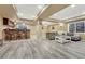 Finished basement with a bar, seating area, and wood-look flooring provides space for entertainment at 10375 Knollside Dr, Parker, CO 80134