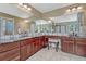 The primary bathroom includes dual sinks, granite counters, and a vanity at 10375 Knollside Dr, Parker, CO 80134