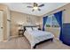 Bright bedroom features carpeted floors, a ceiling fan, and a window with curtains at 10375 Knollside Dr, Parker, CO 80134