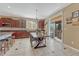 Bright dining area with patio access and breakfast bar enhances the connected open-concept floorplan at 10375 Knollside Dr, Parker, CO 80134