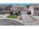 Beautiful two-story home with a well-manicured lawn and an attached two-car garage, plus charming stone accents on the facade at 10375 Knollside Dr, Parker, CO 80134