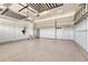 Spacious two-car garage with epoxy flooring, storage racks and ample space for vehicles at 10375 Knollside Dr, Parker, CO 80134