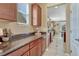 Spacious kitchen with stone counters and ample cabinet space offers a functional and stylish cooking environment at 10375 Knollside Dr, Parker, CO 80134