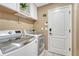 Efficient laundry room featuring modern washer and dryer, providing convenience and functionality at 10375 Knollside Dr, Parker, CO 80134