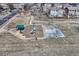 Aerial view of community park featuring playground and basketball court at 10375 Knollside Dr, Parker, CO 80134