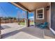 Inviting covered patio with stone pillar, outdoor seating and a view of the backyard at 10375 Knollside Dr, Parker, CO 80134