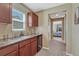 This home features a wet bar with a mini fridge, sink, and window leading to the bedroom at 10375 Knollside Dr, Parker, CO 80134