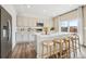 Modern kitchen with stainless steel appliances, a center island, and counter seating at 2153 Flower Blossom Ave, Brighton, CO 80601