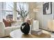 Close-up of living room with decorative vases, books, and pillows at 2153 Flower Blossom Ave, Brighton, CO 80601