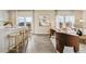 Open-concept living space with hardwood floors and natural light at 2153 Flower Blossom Ave, Brighton, CO 80601