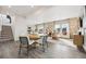 Bright living space with open floor plan, hardwood floors, and abundant natural light at 2153 Flower Blossom Ave, Brighton, CO 80601