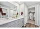 Spacious main bathroom with double vanity, walk-in closet, and tiled shower at 2153 Flower Blossom Ave, Brighton, CO 80601