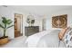 Main bedroom featuring a grey dresser, decorative items, and artwork at 2153 Flower Blossom Ave, Brighton, CO 80601