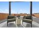 A cozy outdoor patio with comfortable seating and a clear view creating a serene and inviting area at 2153 Flower Blossom Ave, Brighton, CO 80601