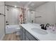 Elegant bathroom featuring a shower-tub combo and a white countertop vanity at 15538 Native Willow Dr, Monument, CO 80132