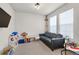 A bright and cheery playroom with plush carpeting and plenty of space for activities at 15538 Native Willow Dr, Monument, CO 80132