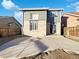 Exterior backyard with a concrete patio area, perfect for outdoor seating and entertaining in a cozy suburban setting at 344 W 116Th Ave, Northglenn, CO 80234