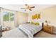 Bright bedroom with patterned textiles, ceiling fan, and large window at 930 Button Rock Dr # 28, Longmont, CO 80504