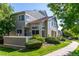Townhome with lush landscaping, showcasing its clean lines and inviting sidewalk at 930 Button Rock Dr # 28, Longmont, CO 80504