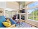 Inviting living room boasts high ceilings, a fireplace, and lots of natural light from large windows at 930 Button Rock Dr # 28, Longmont, CO 80504