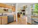 Open floor plan of kitchen into a sunlit living room with fireplace at 930 Button Rock Dr # 28, Longmont, CO 80504