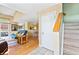 Open-concept living area with hardwood floors, staircase, and sliding doors to the patio at 930 Button Rock Dr # 28, Longmont, CO 80504