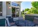 Outdoor patio with seating area, sliding glass doors and a view of the gazebo and backyard at 930 Button Rock Dr # 28, Longmont, CO 80504