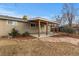 Covered patio and backyard with stone pathway at 6963 S Albion St, Centennial, CO 80122