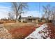 Backyard view showing a large yard and covered patio at 6963 S Albion St, Centennial, CO 80122