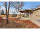 Home's backyard features a covered patio and fenced yard at 6963 S Albion St, Centennial, CO 80122