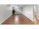 Finished basement room with wood floor and neutral walls at 6963 S Albion St, Centennial, CO 80122