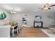 Charming dining room with hardwood floors and view of kitchen at 6963 S Albion St, Centennial, CO 80122