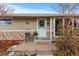 House exterior with brick and siding, welcoming entryway at 6963 S Albion St, Centennial, CO 80122