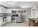 Modern kitchen with stainless steel appliances and granite countertops at 6963 S Albion St, Centennial, CO 80122